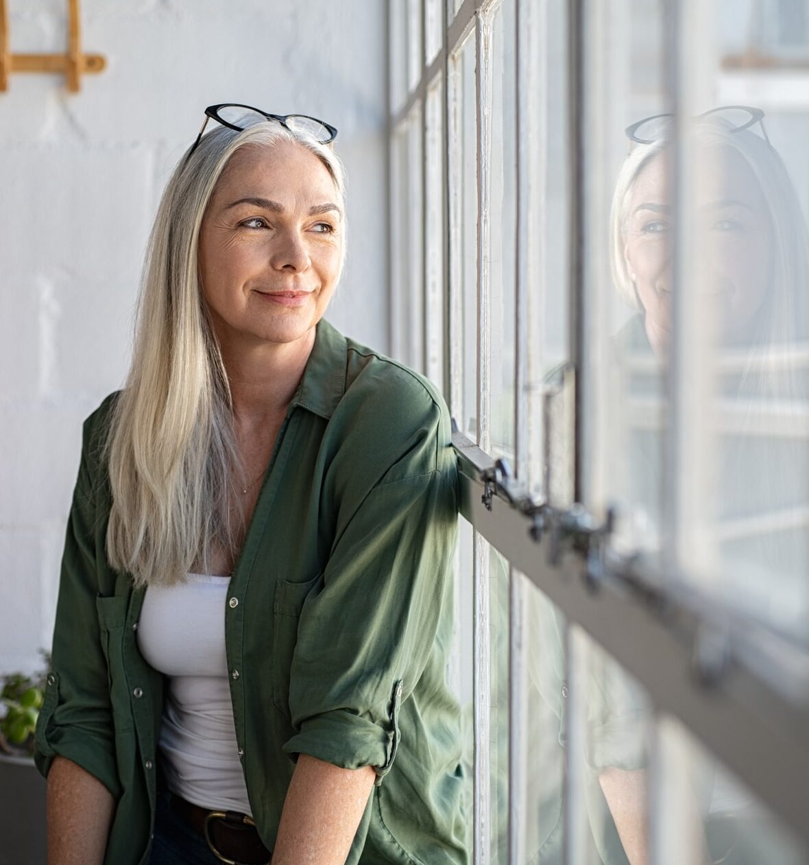 woman looking out a window